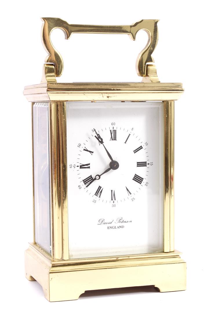 English travel alarm clock in brass case, with address: English travel alarm clock in brass case, with address David Peterson England on dial 15.5 cm high (timepiece fine).