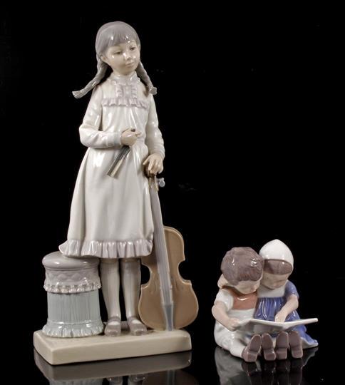 Lladro: Lladro porcelain statue of girl with double bass 30 cm high (with damage) and Bing and Grondahl Denmark porcelain sculpture group of reading children 10 cm high