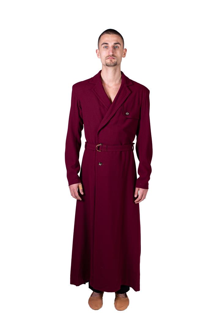 Long men's coat with dark red belt. Costume from: Long men's coat with dark red belt. Costume from celebrAGE (2011), a co-production of choreographers Adriaan Luteijn and Gisela Rocha and photographer and filmmaker Erwin Olaf. Costume design: Sjaak H