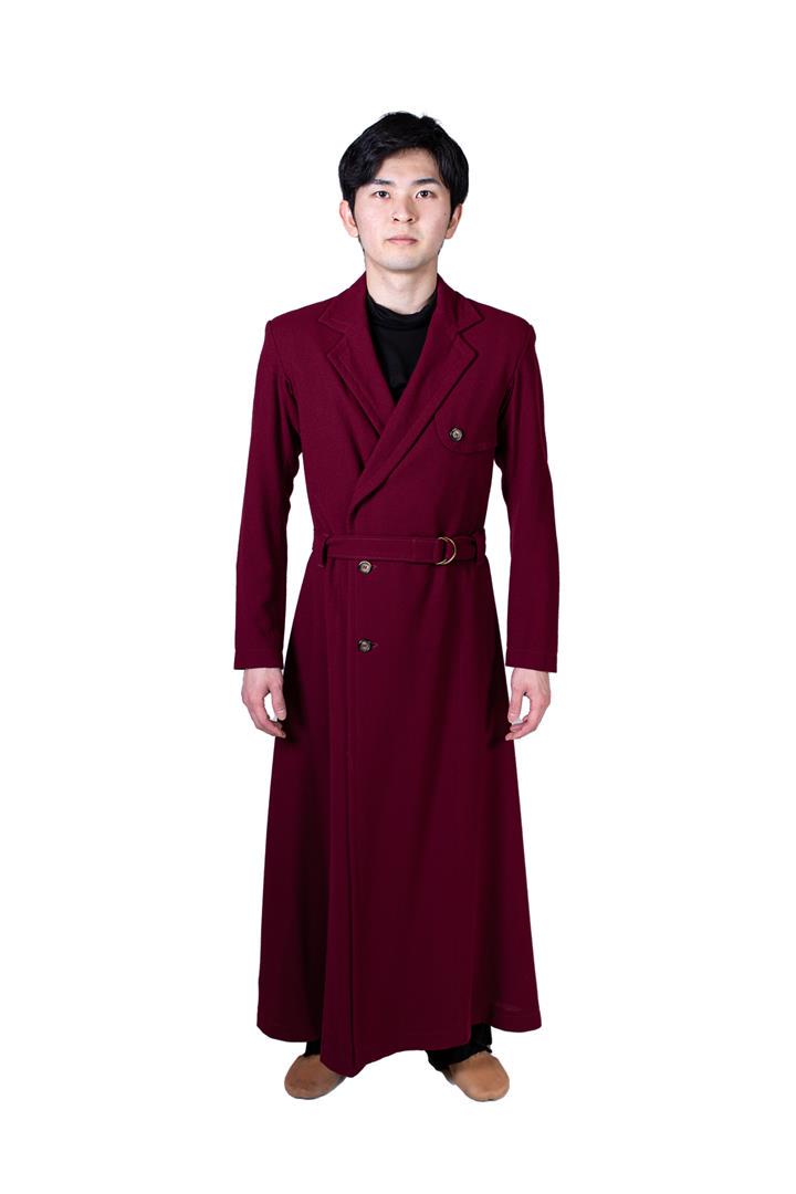Long men's coat with dark red belt. Costume from: Long men's coat with dark red belt. Costume from celebrAGE (2011), a co-production of choreographers Adriaan Luteijn and Gisela Rocha and photographer and filmmaker Erwin Olaf. Costume design: Sjaak H