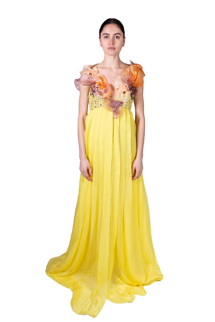 Yellow pleated evening dress with orange-pink neckline: Yellow pleated evening dress with orange-pink neckline decoration. Costume from celebrAGE (2011), a co-production of choreographers Adriaan Luteijn and Gisela Rocha and photographer and filmmaker Erwi