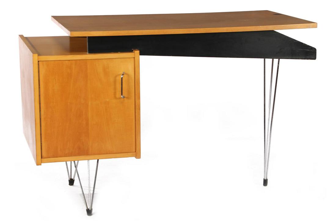 Cees Braakman (1917-1995): Cees Braakman (1917-1995)Birch veneer desk with optically floating top in which open blackened compartment section, cabinet with 2 filing drawers and standing on metal hairpin legs, design Cees Braakm