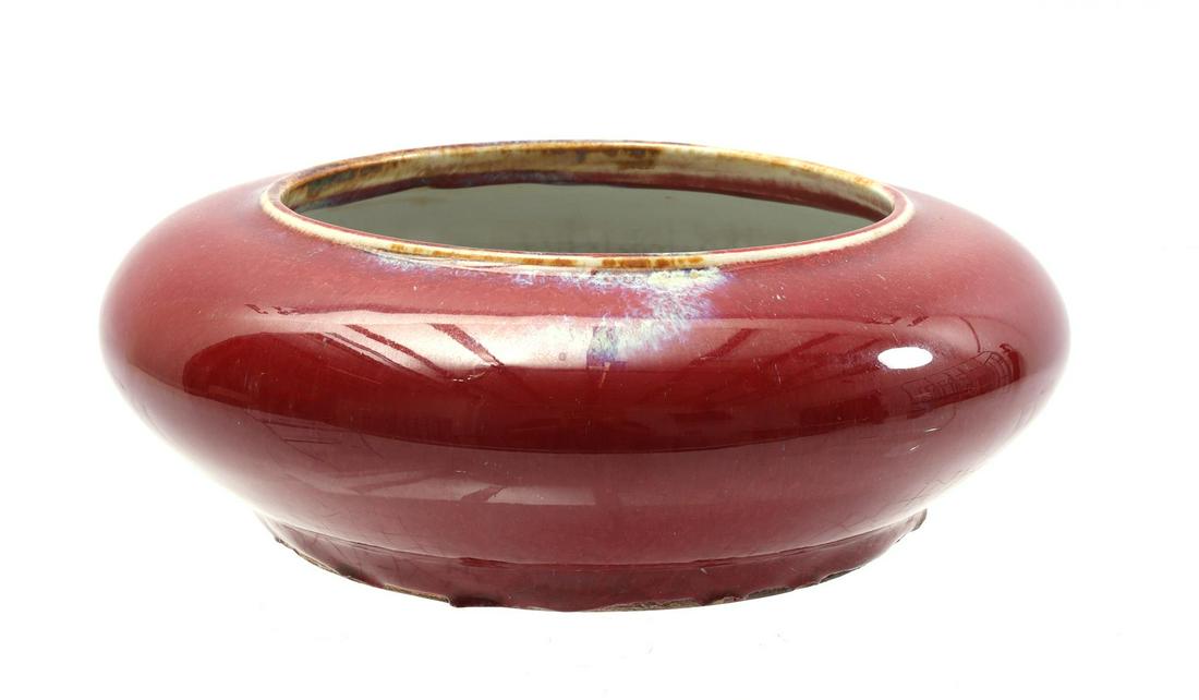 Sang de Boeuf porcelain dish: Sang de Boeuf porcelain dish with wax stamp in the bottom, China ca. 1900, 7 cm high and 22 cm diameter