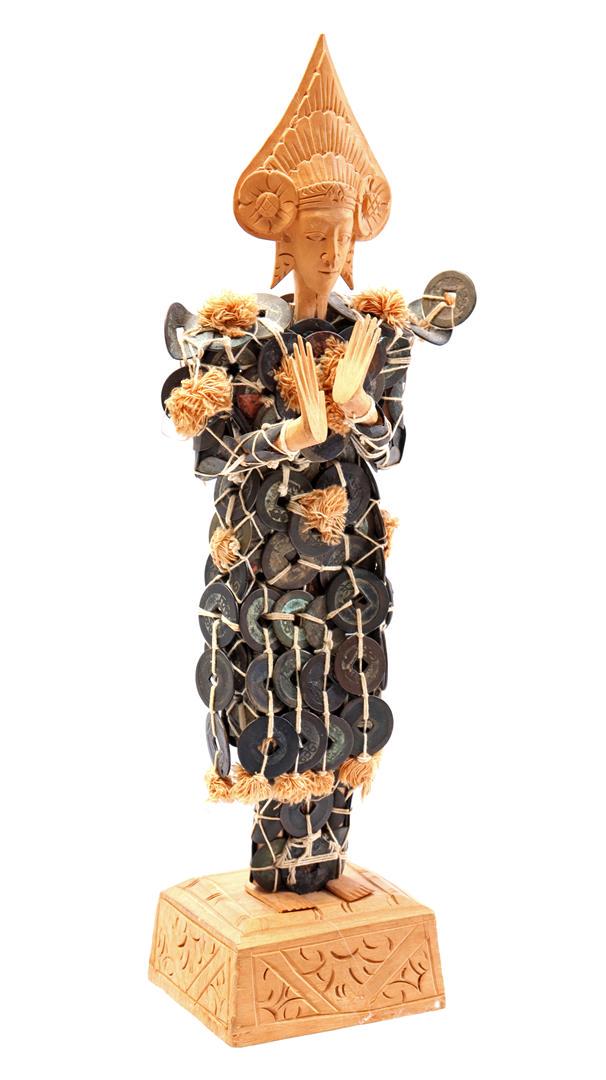 Wooden carved statue of a figure: Wooden carved statue of a figure decorated with kepeng coins, Indonesia 20th century, 37 cm high