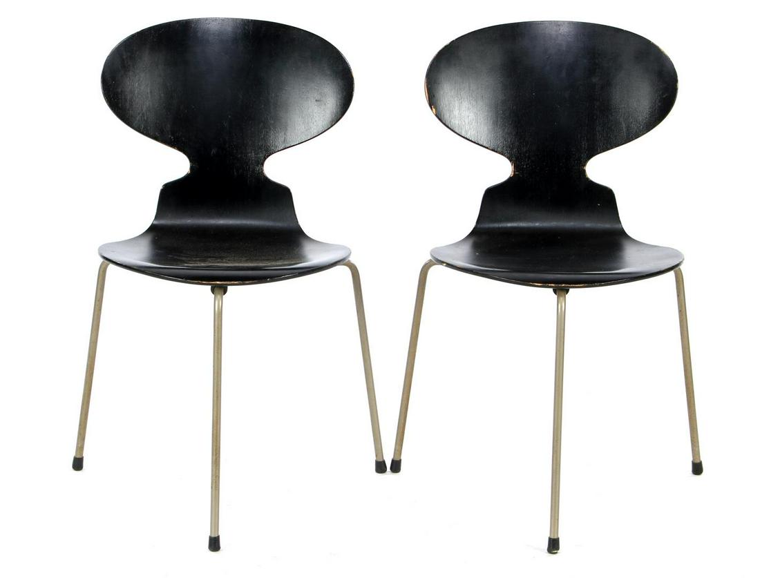 Arne Jacobsen (1902-1971): Arne Jacobsen (1902-1971)2 blackened plywood chairs on a tubular frame, 3-legged base, design Arne Jacobsen for Fritz Hansen, model Ant/3100, marked on the bottom, Denmark design year 1952, early edit