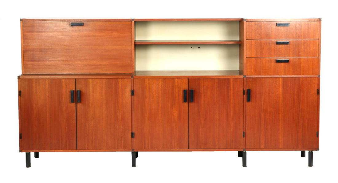 Cees Braakman: Cees Braakman (1917-1995)Teak veneer wall unit with flap section, 2 open compartments, 3 drawers with curved inner sides, 6 doors behind which pull-out shelves, standing on blackened metal legs, desig