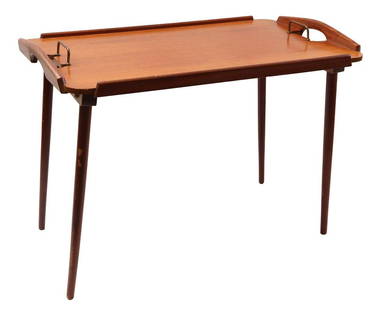 Bendt Winge: Bendt Winge (1907-1983)Foldable teak serving table with brass handles and standing on tapered legs, design Bendt Winge for Aase Dreieri Gandall, stickered and stamped on the bottom, Norway 1950s, 46.5