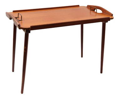 Bendt Winge: Bendt Winge (1907-1983)Foldable teak serving table with brass handles and standing on tapered legs, design Bendt Winge for Aase Dreieri Gandall, stickered and stamped on the bottom, Norway 1950s, 46.5