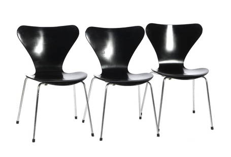 Arne Jacobsen: Arne Jacobsen (1902-1971)3 blackened plywood dining room chairs on tubular frame base, design Arne Jacobsen, executed by Fritz Hansen, model 'Vlinder/Butterfly/Series 7', Denmark 1973, marked on the b