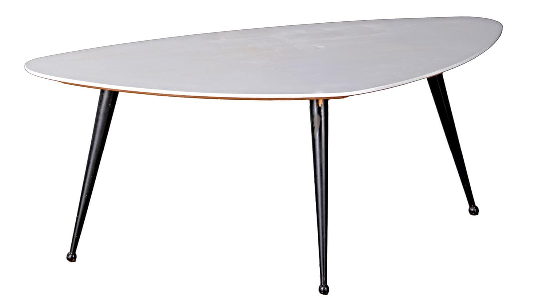 Cees Braakman: Cees Braakman (1917-1995)Laminated teak trigonal white lacquered coffee table with blackened tapered legs ending in a sphere, design by Cees Braakman, executed by Pastoe, model 'TB39', marked on the b