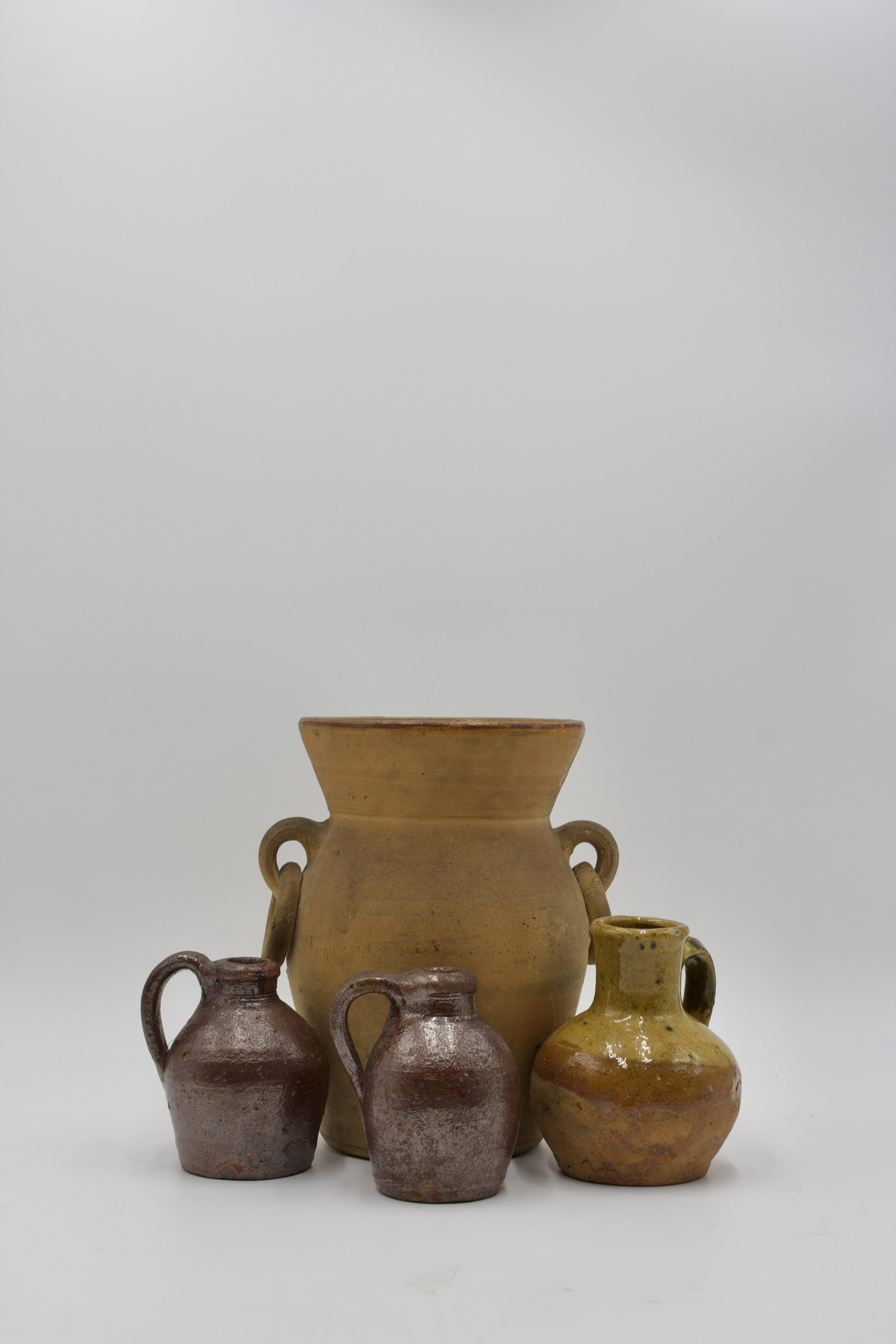 TWO ALBANY JUGS, FRENCH GLAZED PITCHER, TANWARE VASE. (1 of 10)