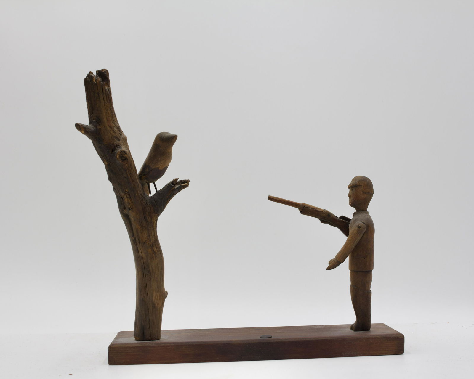 FOLK ART HUNTER WITH BIRD CARVING. (1 of 4)