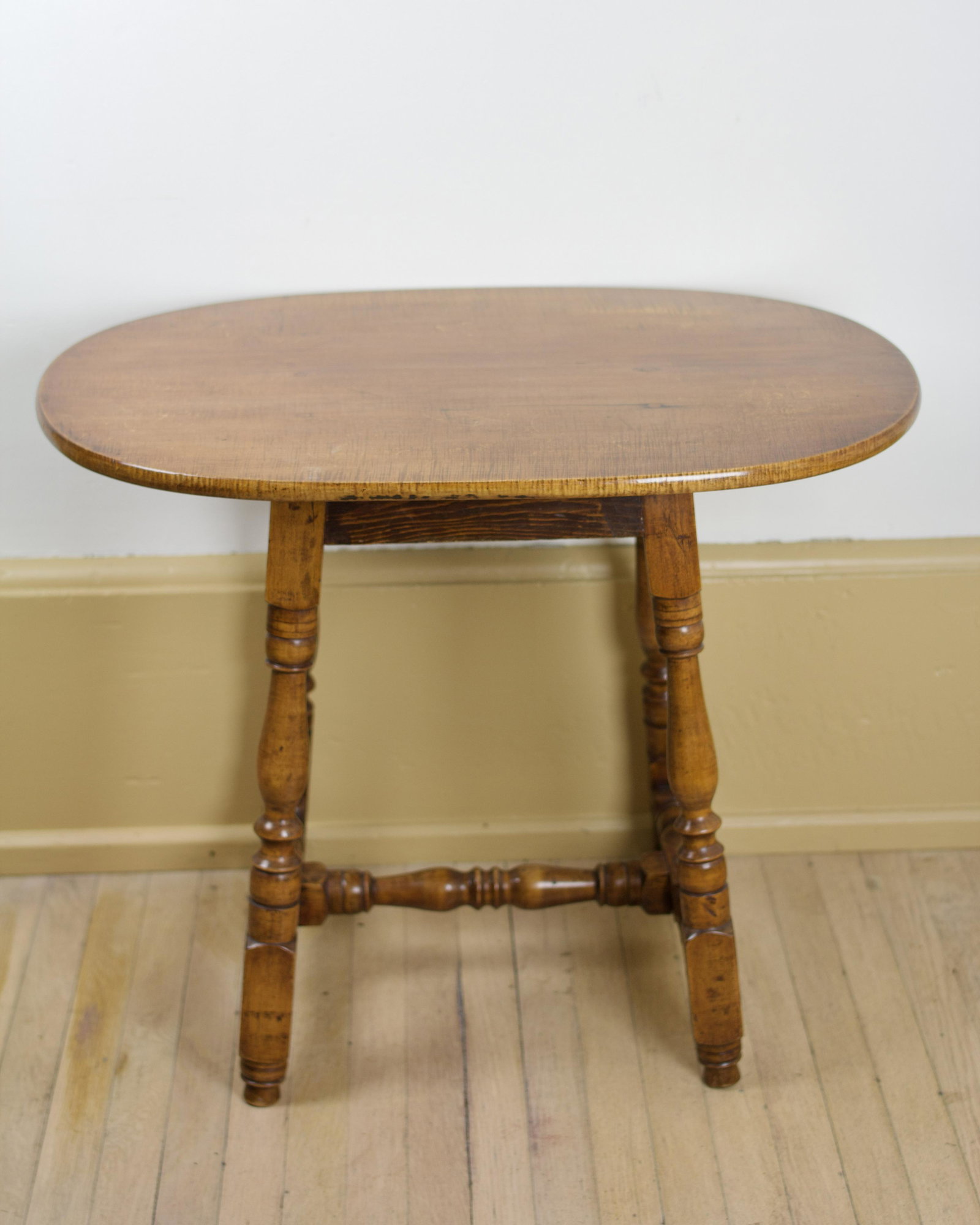 MAPLE AND TIGER MAPLE TAVERN TABLE.: American, 18th Century. Varnish, splay legs. 23.75"h 29"l 19.5"w. Provenance: Having sold at Collings & Collings Antiques, New York (retains early 20th Century label).