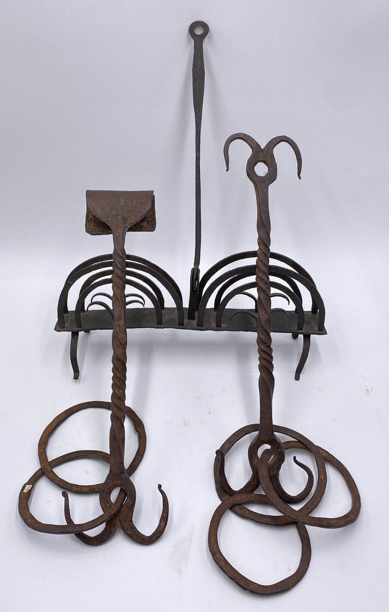 TWO IRON HANGERS AND TOASTER. (1 of 4)