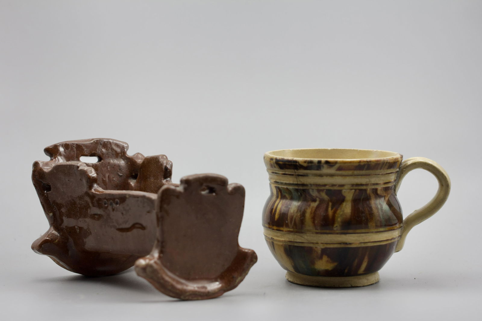 REDWARE CRADLE AND YELLOWWARE CUP. (1 of 3)