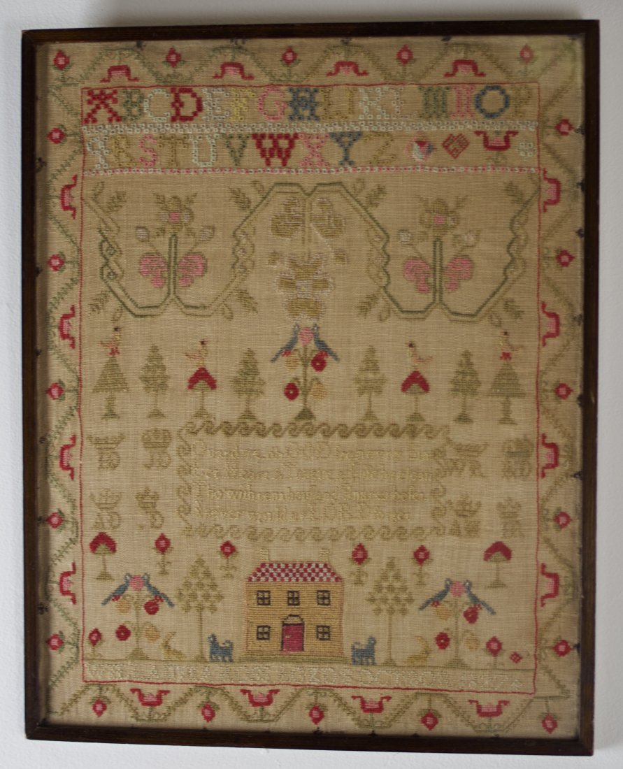 PICTORIAL SAMPLER.: English, second quarter 19th Century. Yellow house with red and white checkerboard roof flanked by two trees. Dogs and rabbits facing birds perched in trees. Frame, 17.5"h. 14"w.