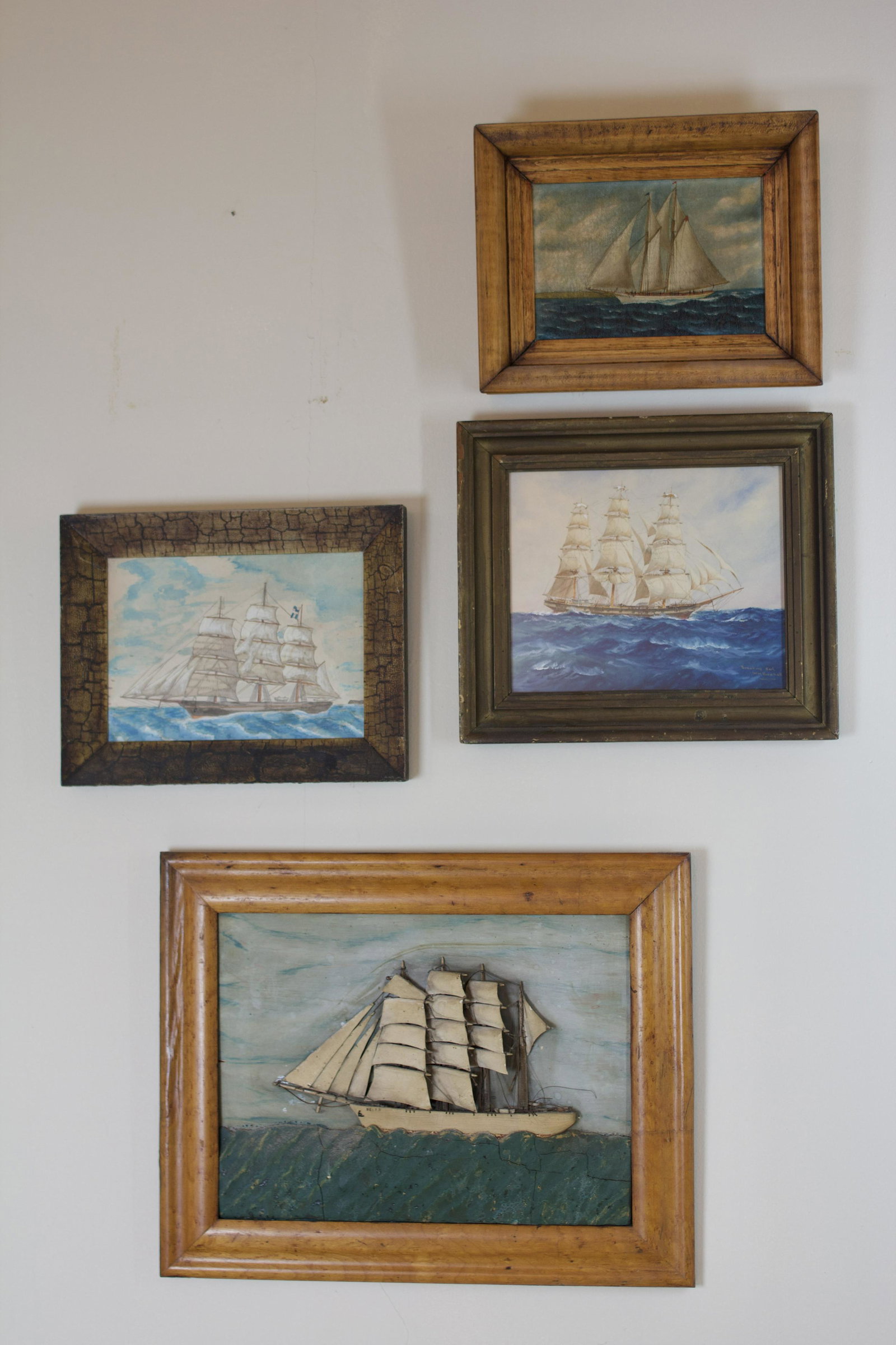 GROUP OF ARTWORK FEATURING SHIPS.: American, 20th Century. Group of: (1) plaque with sailing vessel “Helen”, original paint in birdseye maple frame, water plaster composition with cracks, some damage to sails, early 20th Ce