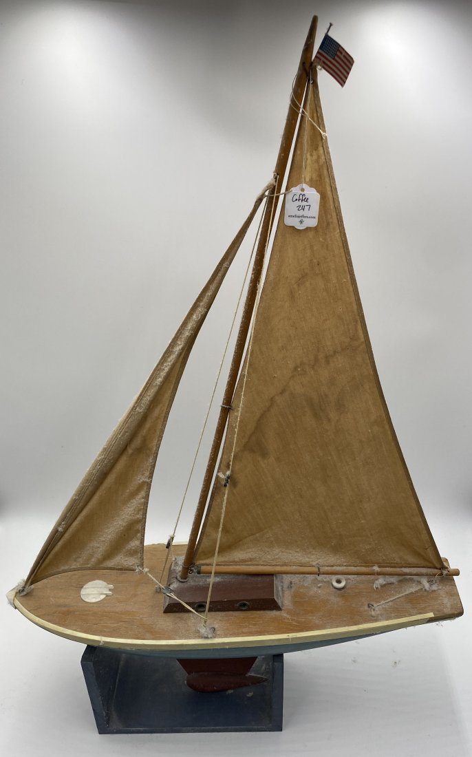POND SAIL BOAT.: American, 20th Century. Red, white, and blue paint. 19"l. 28"h. 5.5"w.