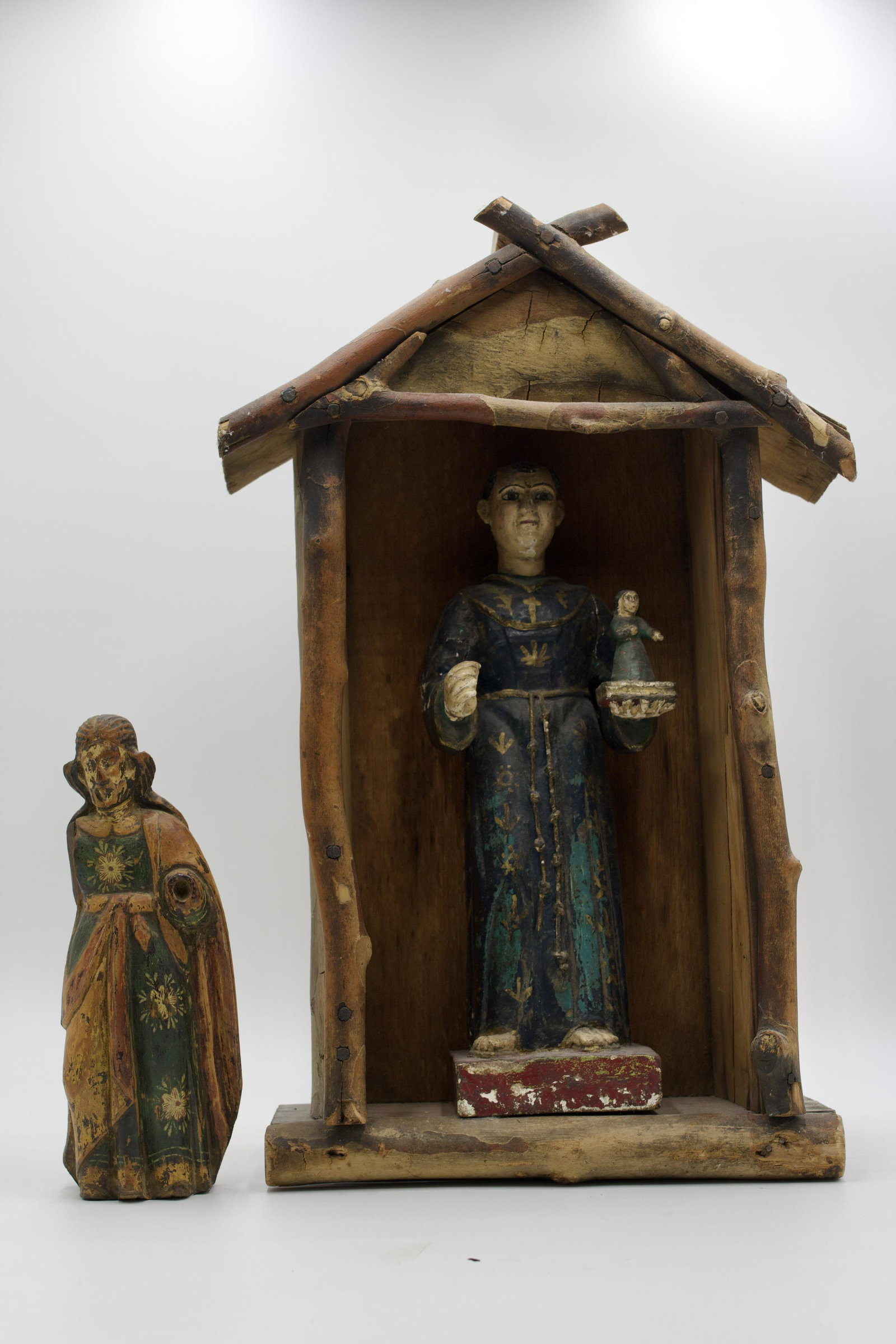SAINT ANTHONY SANTOS AND CHRISTO.: Likely Mexican, 18th or 19th Century. House 19.5"h. 12"w. 5.5"d. Figure 9"h. 3.5"w. 2.25"d.