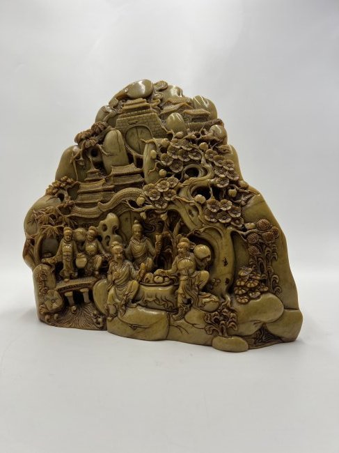 CARVED SOAPSTONE WITH FINELY CARVED DETAIL.: China, 19th or 20th Century. With five figures, trees, and buildings.