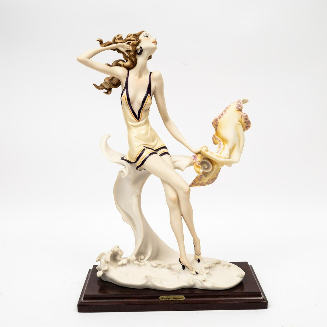 "SUMMER 1989-SEASHORE" PORCELAIN FIGURINE BY GIUSSEPPE ARMANI (1993-2006).: Italy, 1989. Capodimonte porcelain figurine titled "Summer 1989-Seashore" by Giuseppe Armani for Florence Scultur D'Art. Signed and marked with the blue crown capodimonte mark. Excellent condition. 9.