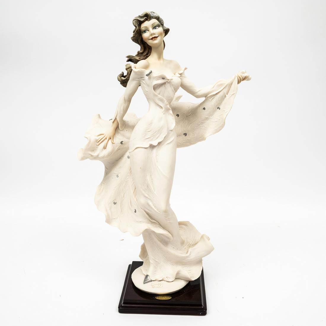 "LADY WYNNE" PORCELAIN FIGURINE BY GIUSSEPPE ARMANI (1993-2006).: Italy, 1998. Capodimonte porcelain figurine titled "Lady Wynne" by Giuseppe Armani for Florence Scultur D'Art. Signed in the mold and marked with the blue crown capodimonte mark. Excellent condition. 