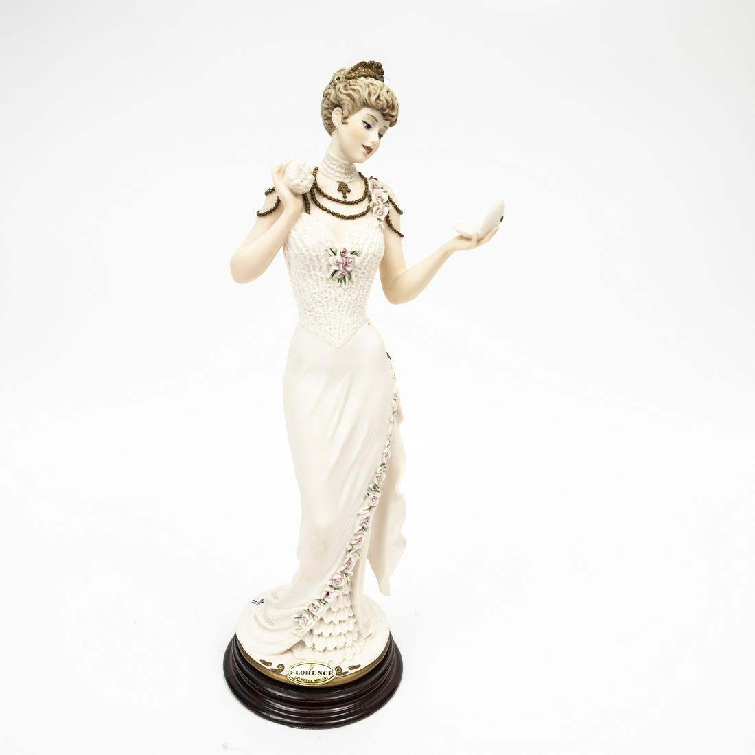 "SERENA" PORCELAIN FIGURINE BY GIUSSEPPE ARMANI (1993-2006).: Italy, 1998. Capodimonte porcelain figurine titled "Serena" by Giuseppe Armani for Florence Scultur D'Art. Signed in the mold and marked with the blue crown capodimonte mark. Excellent condition. 6"w.