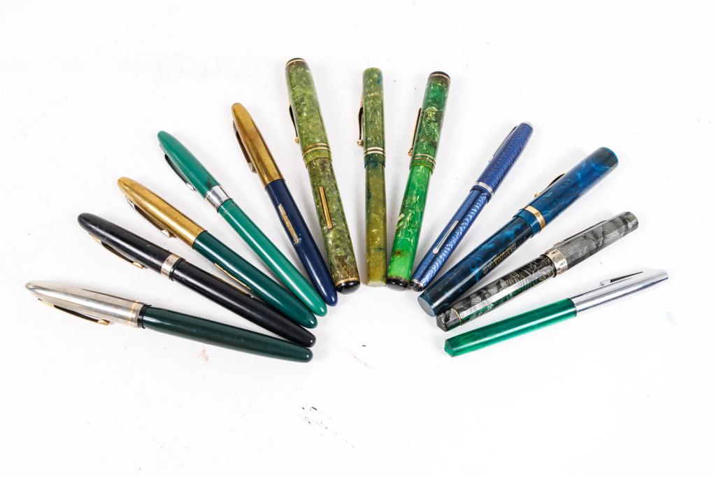 GROUP OF TWELVE FOUNTAIN PENS.: 20th and 21st Century. Three by Carters: two green with gold clip (one with ink stains), 5"l. and 5.5"l., one blue with gold clip and 14k nib, 5.375"l.; two by Sheaffer: green and silver, 5"l. and 5.3