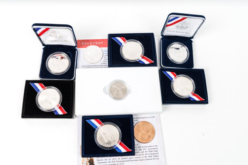 GROUP OF AMERICAN COINS.: American, 20th & 21st Century. 2009 Louis Braille Bicentennial Uncirculated Silver Dollar in original case; 2010 Boy Scouts of America Centennial Proof Silver Dollar in original case; 2010 Boy Scouts 