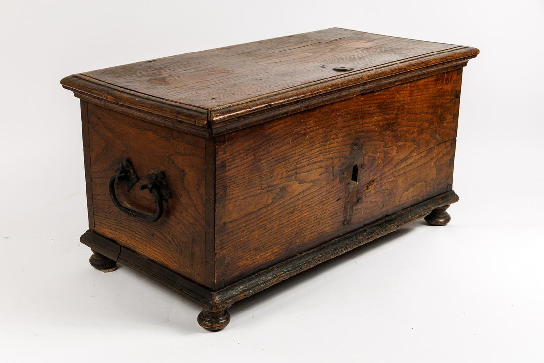 EARLY DIMINUTUVE DOVETAILED BOX WITH ELABORATE IRON HARDWARE AND LOCK.: American, 18th Century. Oak with till and beautiful and elaborate wrought iron hardware including hinges with exposed batwings on back and shaped, incicsed strap on interior; heavy bale handles on eac
