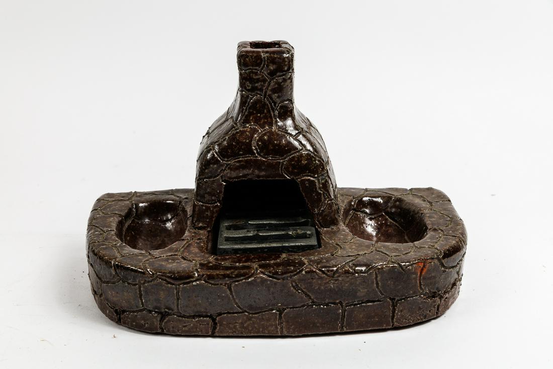UNUSUAL SEWER TITLE FIREPLACE ASHTRAY.: American (Ohio), 20th Century. Signed "L Staley" (Louie Staley, Tuscarawas County). Unusual lodge-like ashtray. 6.5" x 9.5".