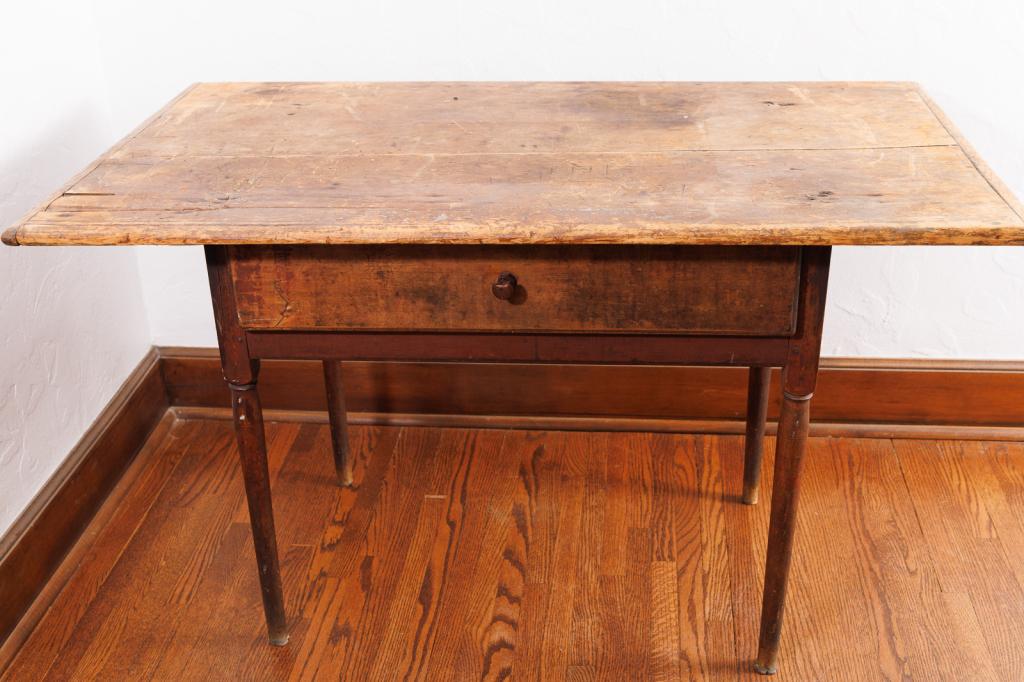 QUEEN ANN TAVERN TABLE.: American, 18th Century, circa 1760. Two-board scrub top with breadboard ends. Original pull. Remnants of button feet. 24 .5" x 44” top. 26.5”h.