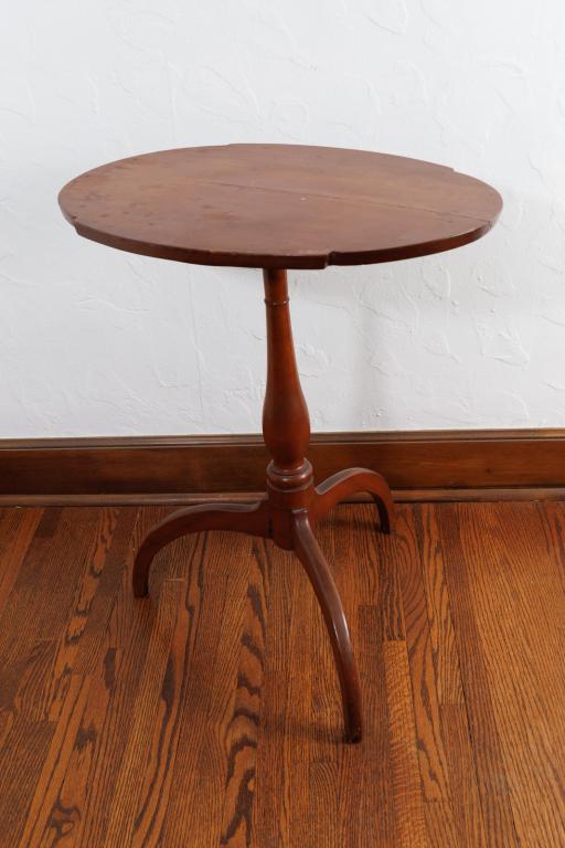 HEPPLEWHITE CANDLE STAND.: American, 19th Century, circa 1820. Cherry. Oval top with shaped ends; spider legs. With good color and patina. 28”t.