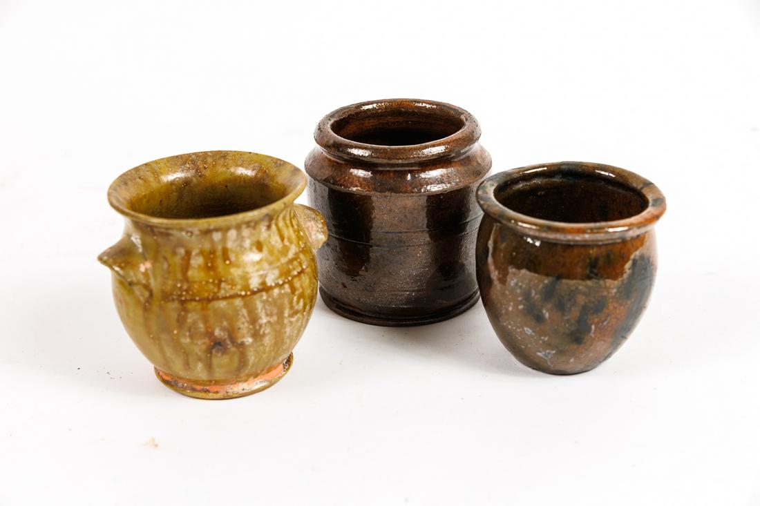 MINIATURE REDWARE.: American, 19th & 20th Century. Two Manganese decorated miniature jars along with a Thomas Stahal miniature crock dated 1935. 3"h.