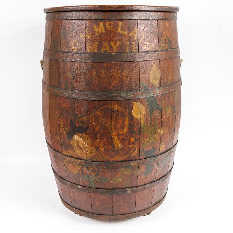 DECORATED PICKLE OR CRACKER BARREL.: American, 19th Century, circa 1890. Oak with advertisement and decoration for D.N. McClain. Original surface. On wheels. 15''d. 25''h.