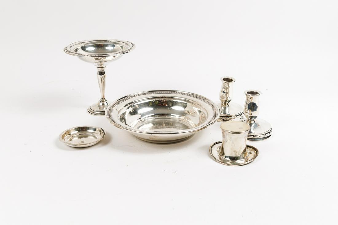 GROUP OF STERLING SILVER TABLE ITEMS.: American, 19th & 20th Century. Two Towle weighted candlesticks, 3.25"h. 3.5"d. base; Courtship International weighted tazza, 6"h. 6"d.; Reed & Barton top hat (dented) 2.25"h. 3.5"d.; Allan Adler round