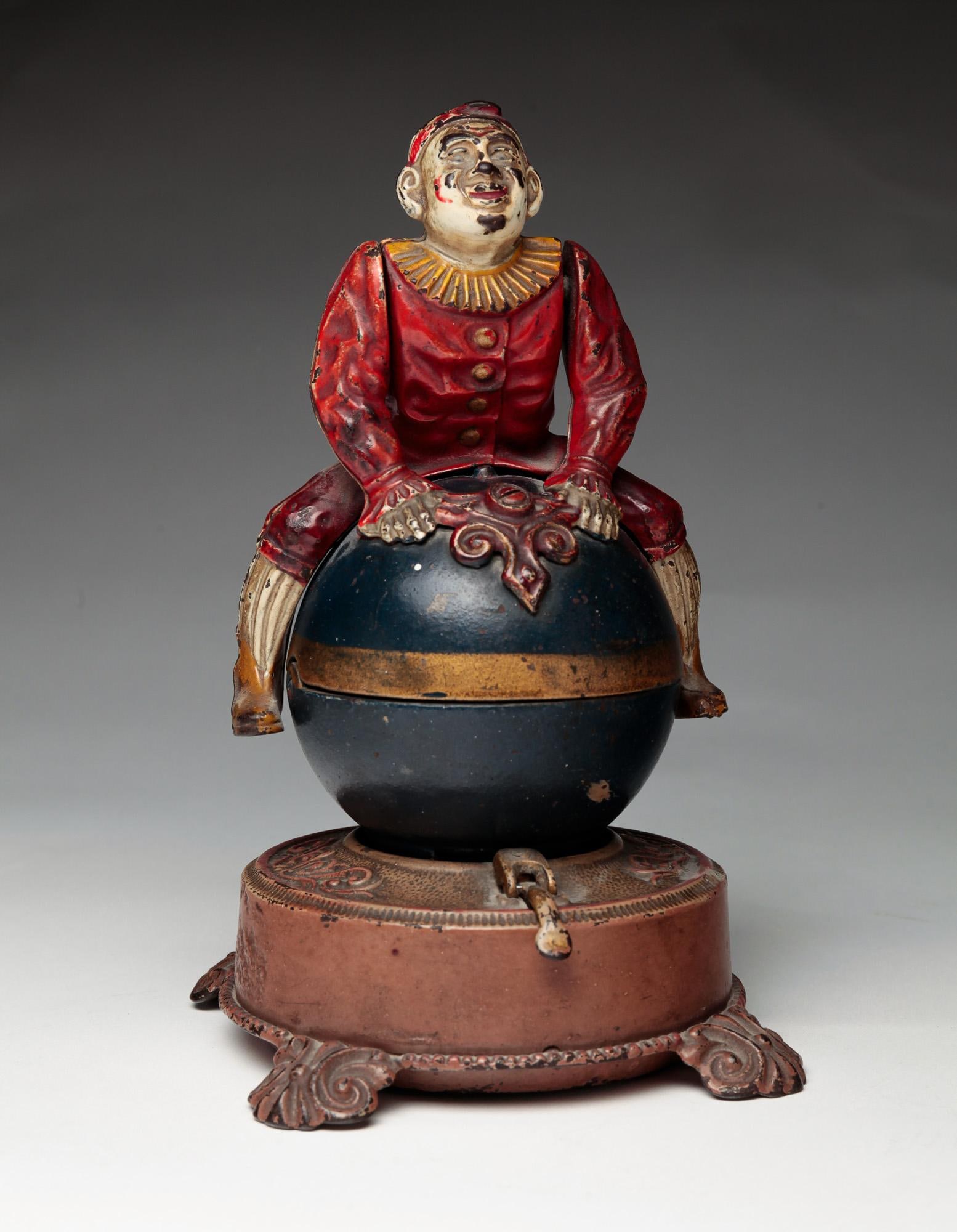 A J. & E. STEVENS "CLOWN ON GLOBE" MECHANICAL BANK. (1 of 15)