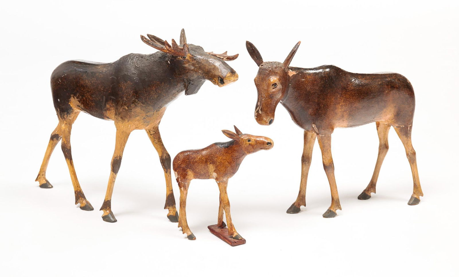 CARVED AND PAINTED MOOSE FAMILY. (1 of 3)