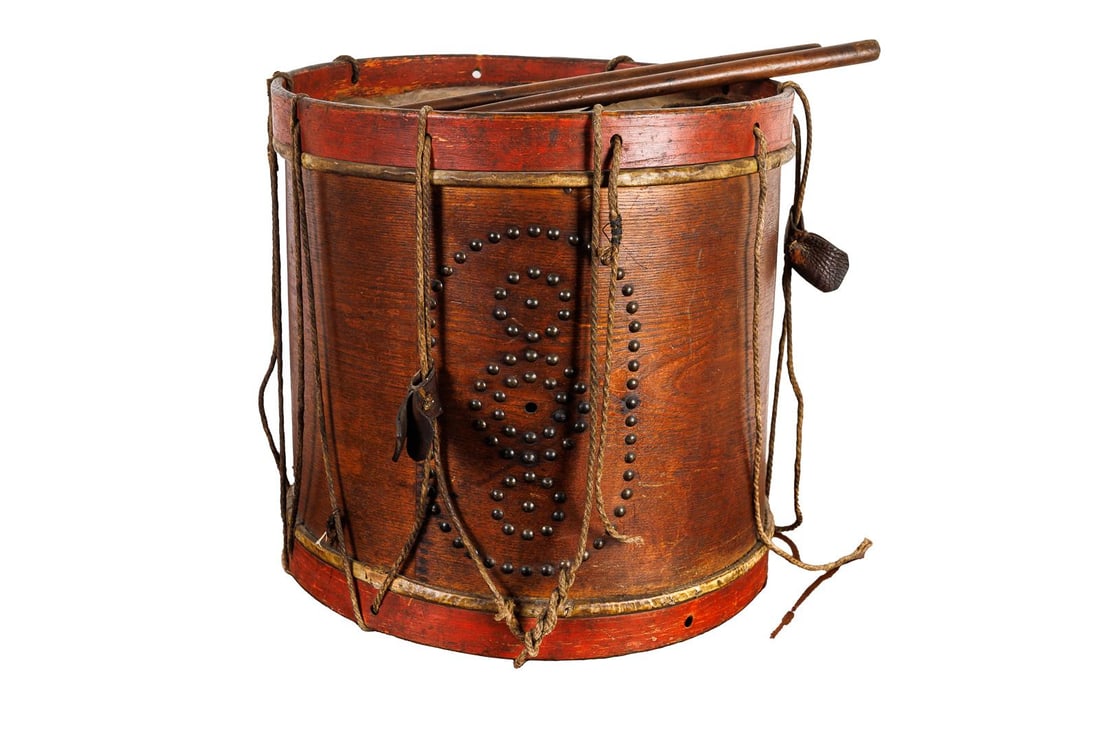 CIVIL WAR ERA WOOD DRUM.: American, 19th Century. Pine. Drum with tack decoration. Original sticks and roping. 16"h. 16.5"d.
