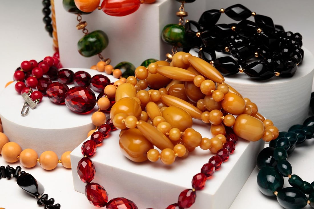 FIFTEEN MID-CENTURY STRANDS OF BEADS. (1 of 4)