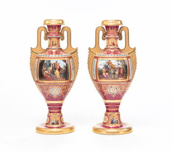 PAIR OF ROYAL VIENNA SIGNED CLASSICAL URNS.: Second half 19th century, porcelain, hand marked with underglaze blue beehive. Two piece. Amphora shaped with gilt rims, Greek key decorated feet and stippled handles. Burgundy ground with four hand p