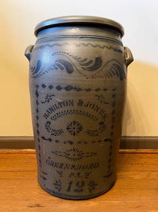 TWELVE GALLON DECORATED HANDLED STONEWARE JAR.: American, second half 19th Century. Cobalt freehand plumes, stripes, and stenciled "Hamilton Hones, Greensboro, Pa" and "12". Along with other stenciled decorations. Rim chip. 22"h.