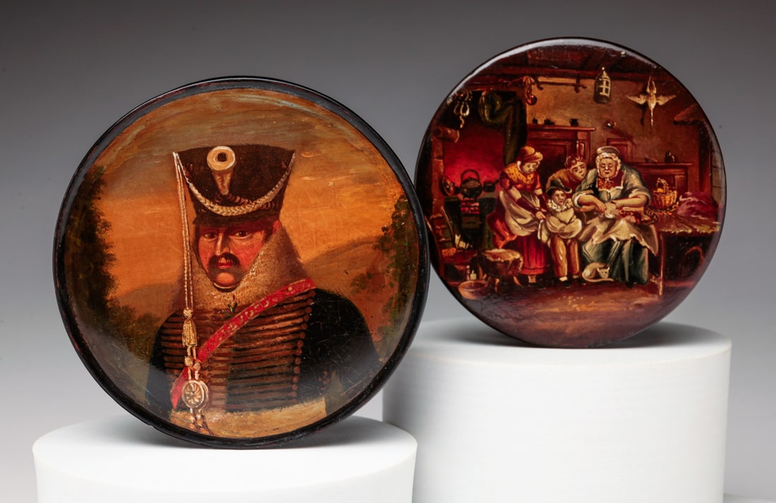 TWO EUROPEAN PAPIER MACHE SNUFF BOXES.: Second half 19th Century. Round lacquered and hand decorated boxes with original paint. Military officer, 3.75"d. and interior kitchen scene of a woman stuffing a goose, 3.25"d. Minor wear.