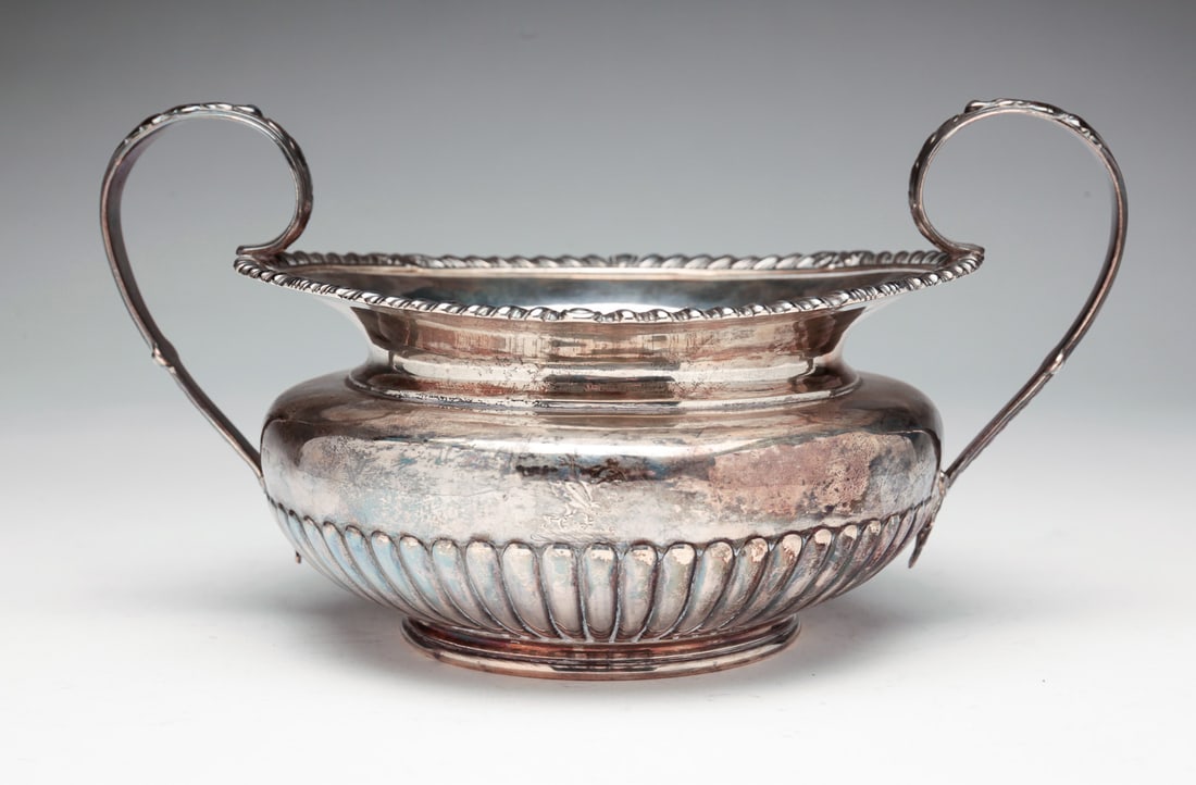 ENGLISH SILVER SUGAR BY PAUL STORR.: London hallmarks, date appears to be 1815 with maker marks. Ribbed bowl, acanthus leaf handles and gadroon rim. 4.75"h. 8.5"w. Approx. 14 ozt. See lot 197 for near matching creamer.