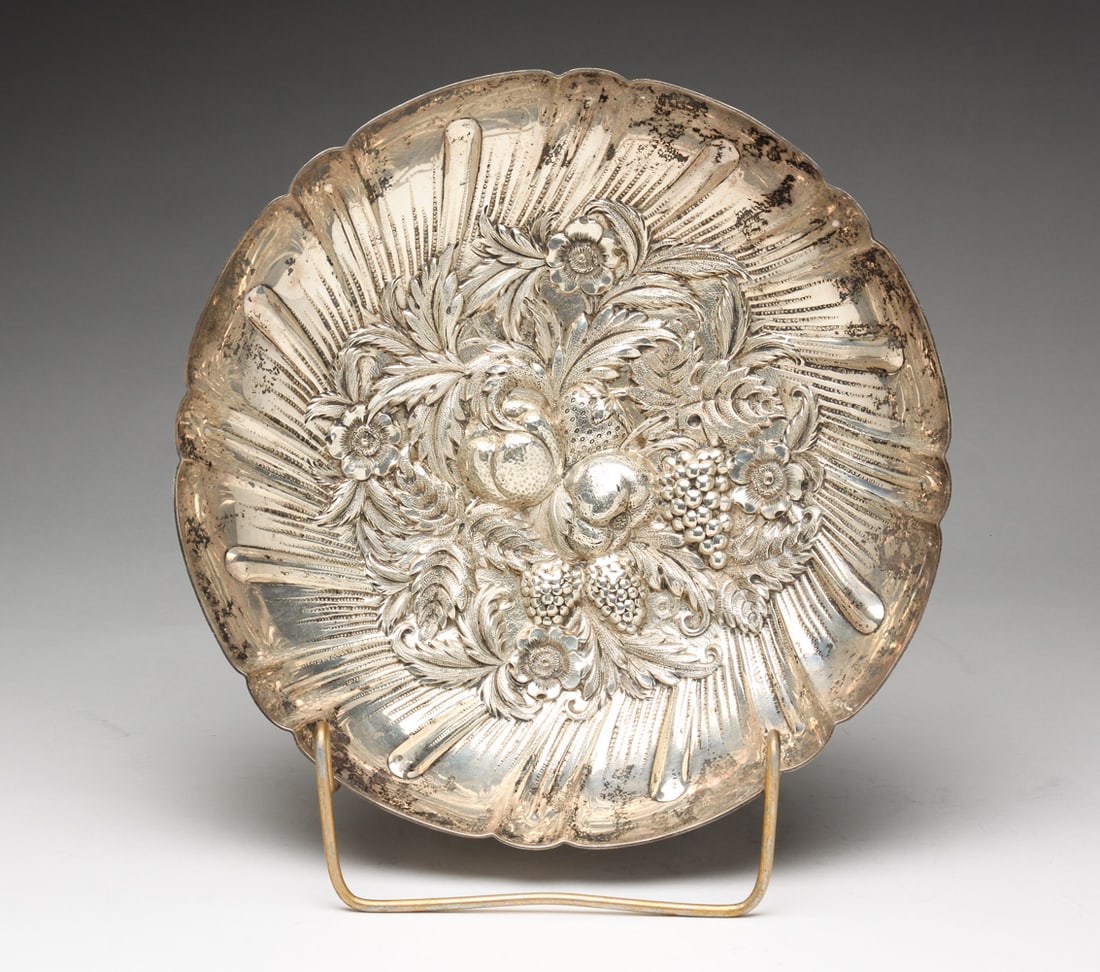 "KIRK & SON" STERLING BERRY DISH.: American, early 20th Century. Marked "S. Kirk & Son, Sterling". Ball feet and repousse fruit. 2.5"h. 9.5"d. Approx. 16 ozt.