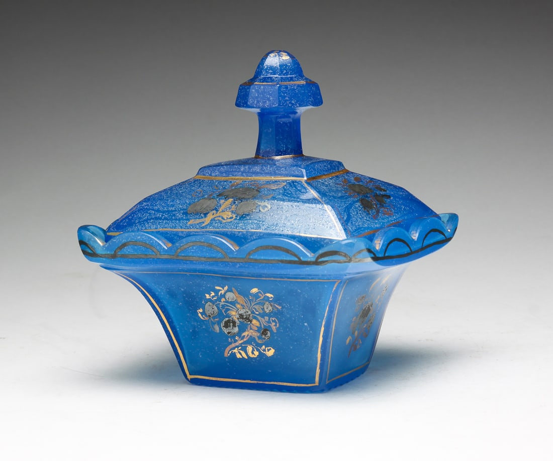 BLUE COVERED GLASS DISH.: Possibly Sandwich, second half 19th Century. Blue opaline with gilt berry decoration and sanded surface. Scallops on base have ground edges. Wear. 6.5"h. 6"w. 5"d.