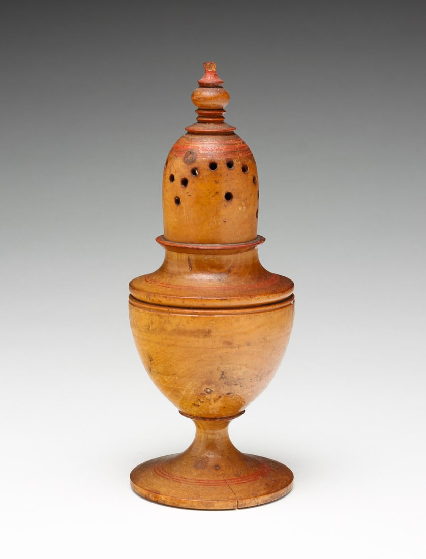 TREENWARE PEPPER POT.: American or English, first half 19th Century. Original red painted accents. Age split, minor loss to finial. 6"h.