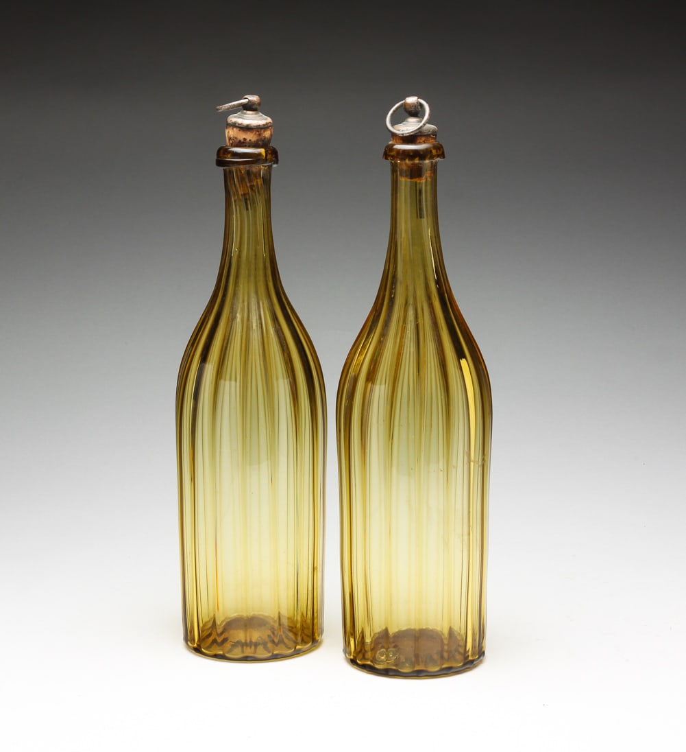 PAIR OF SCOTTISH AMBER BLOWN GLASS RIBBED BOTTLES. (1 of 5)