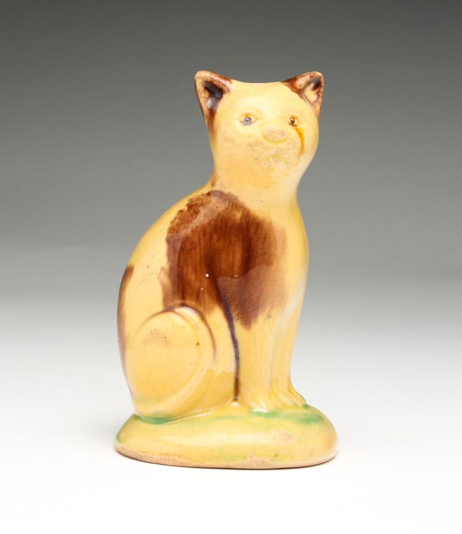 AMERICAN YELLOW POTTERY CAT BANK. (1 of 5)