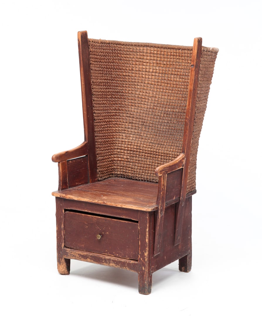 SCOTTISH ORKNEY ISLANDS WINGBACK CHAIR.: Circa 1800, pine. Small with simple construction with woven straw back, lower drawer and original worn reddish brown paint. Age splits, loss, insect damage and wear. 14.5" seat ht. 41.5"h.